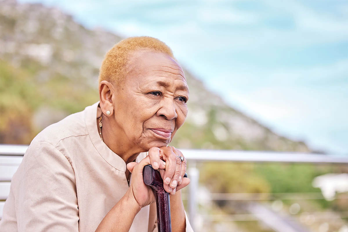 Older woman with walking stick