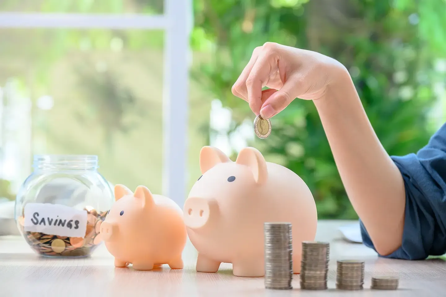 Coins, jar with coins, and piggy banks