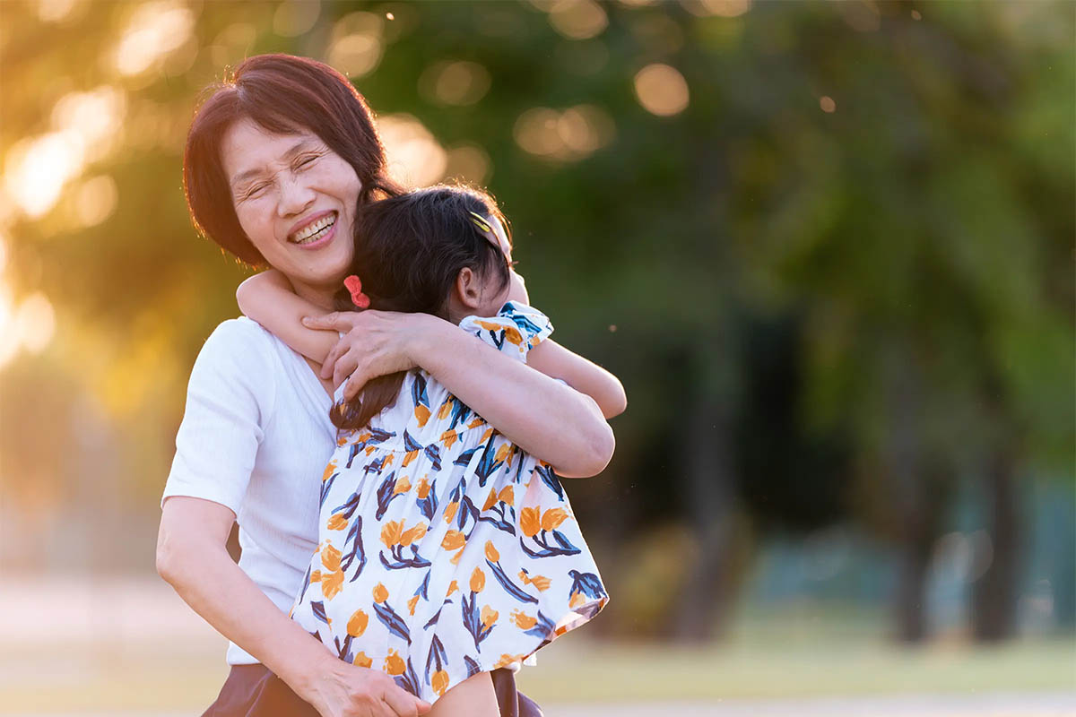 Grandmother hugging her granddaughter