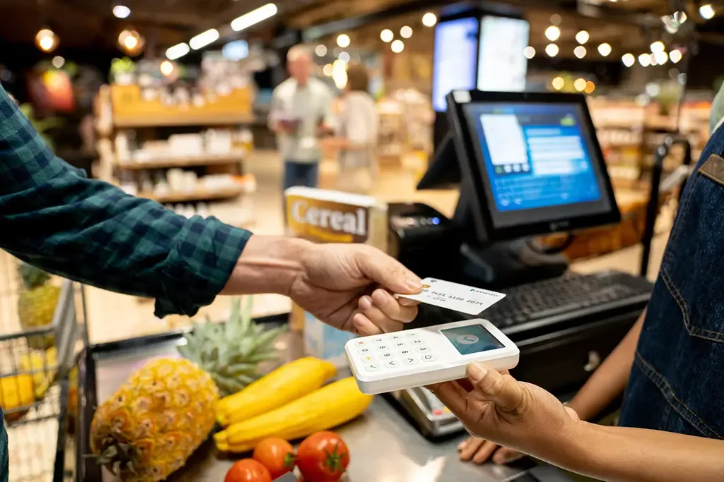 Paying with a credit card at a grocery store